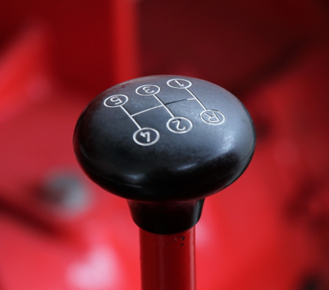 Porsche tractors have a fairly straightforward shifter in the middle. The Standard even had five forward speeds plus a reverse gear.